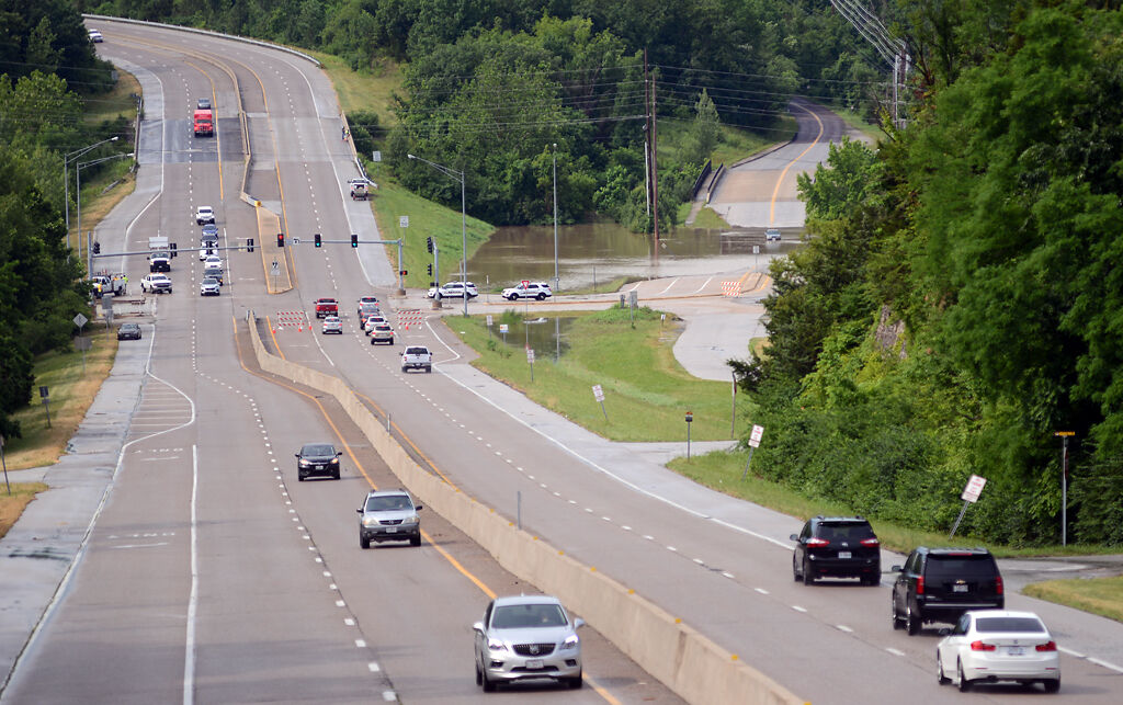 Record flooding impacts Providence Road at Hinkson Creek